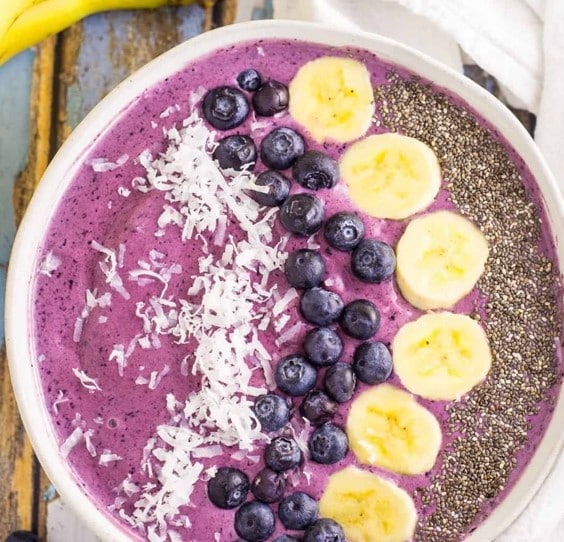 Top down view of a Blueberry Smoothie Bowl with coconut and chia seeds.