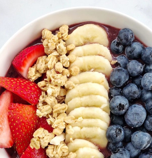 Close up of Vegan Smoothie Bowl with Acai, bananas and granola.