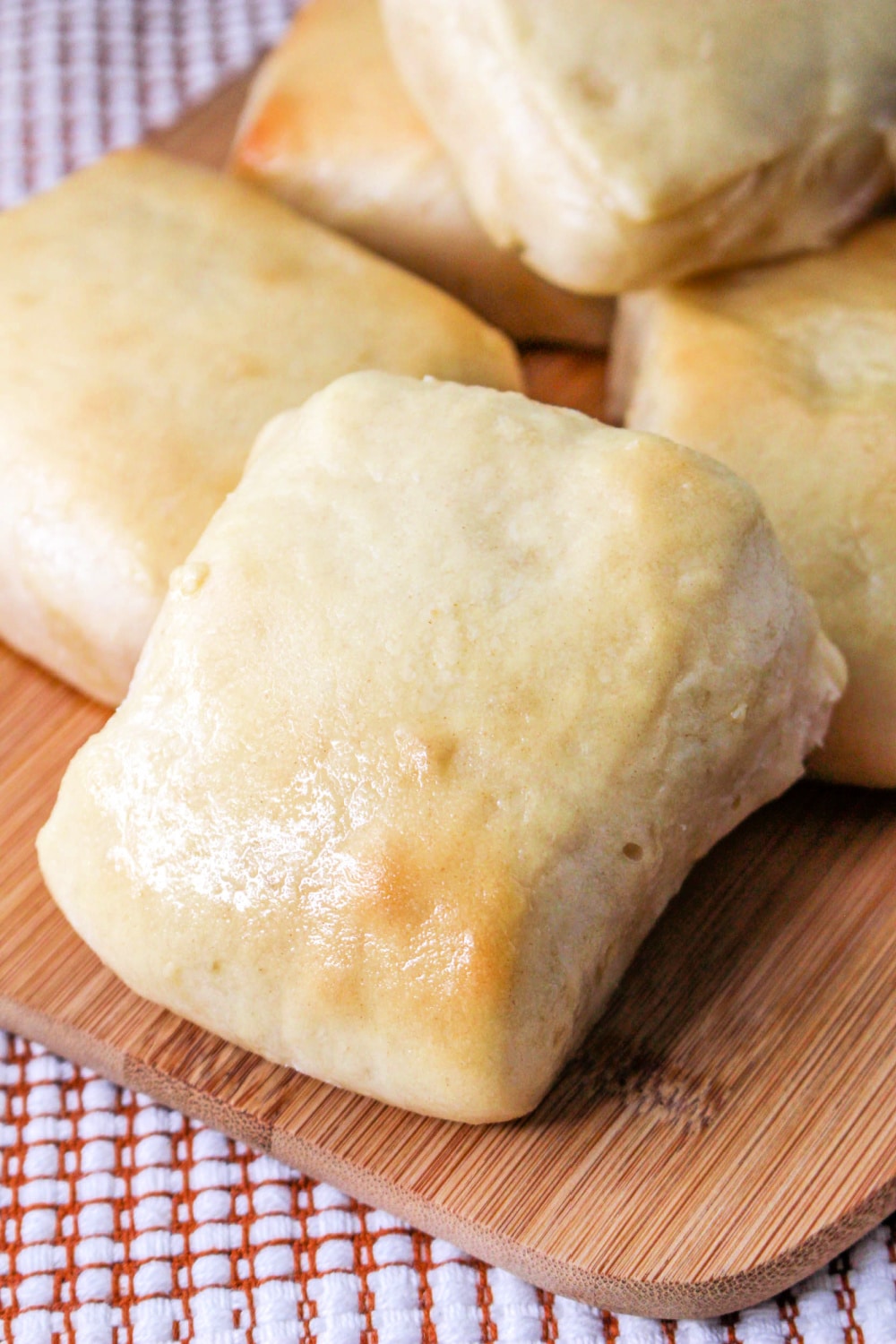 Texas Roadhouse Rolls on a cutting board.