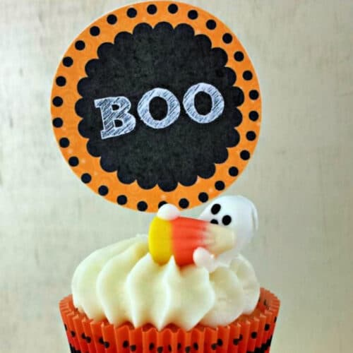 BOO Cupcake Topper Free Printable on a cupcake with a ghost and candy corn.