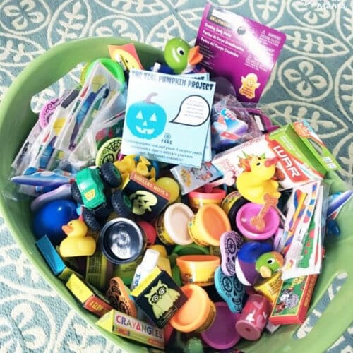 Bucket of food free Halloween treats for The Teak Pumpkin Project.