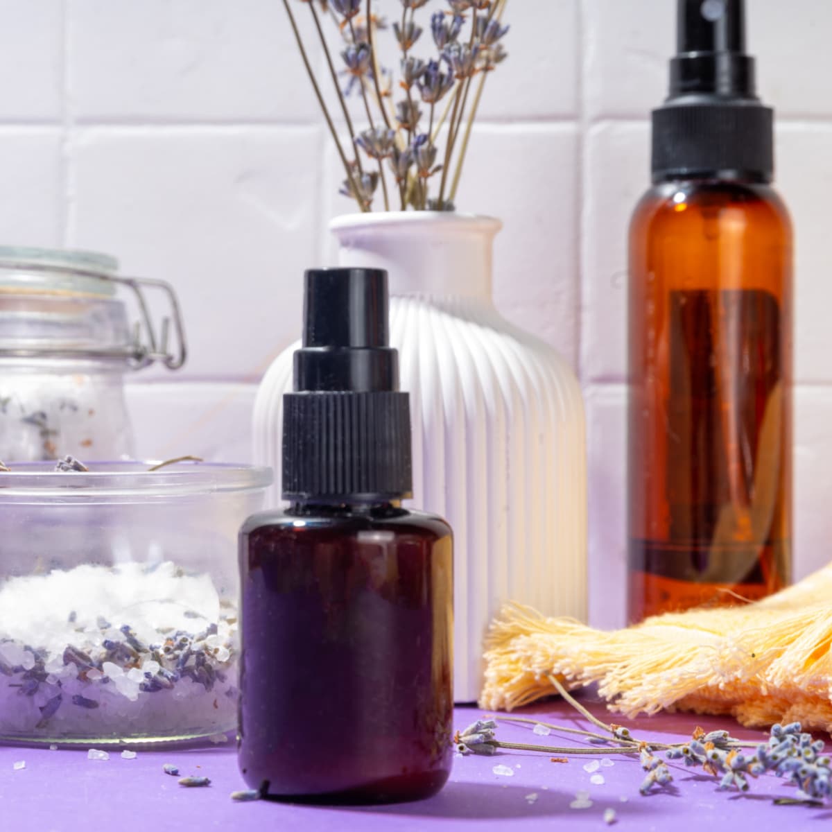 Bathroom countertop with Lavender Linen Spray and bath salts.