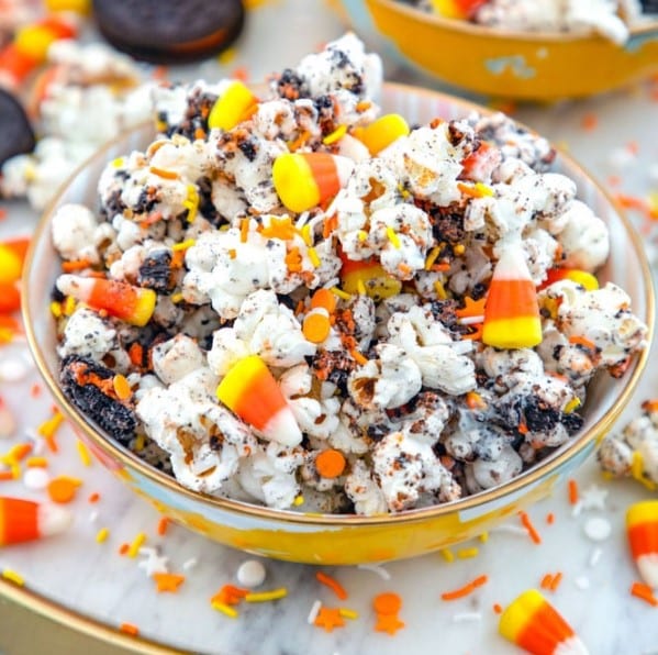 Bowl of Halloween Party Popcorn with candy corn.