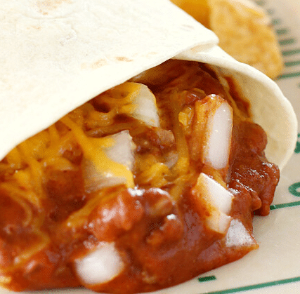 Close up of Chili Cheese Burrito with onions.