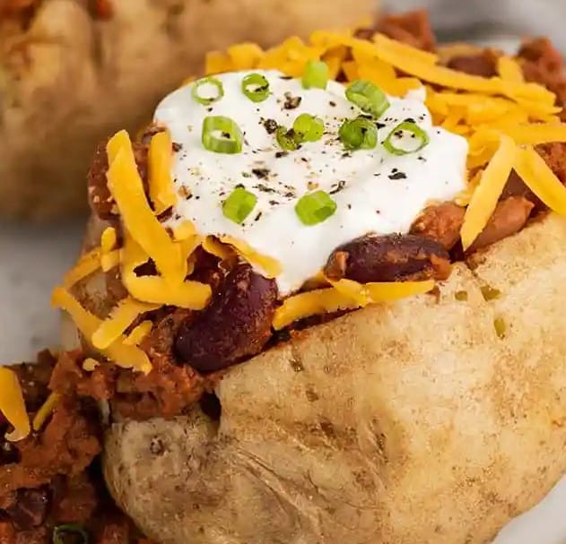 Close up of chili baked potatoes.