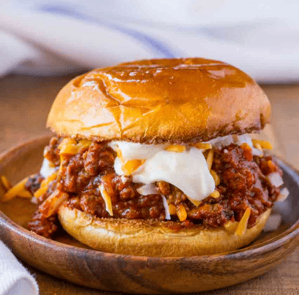 Chili Cheese Sloppy Joes sandwich on a plate.