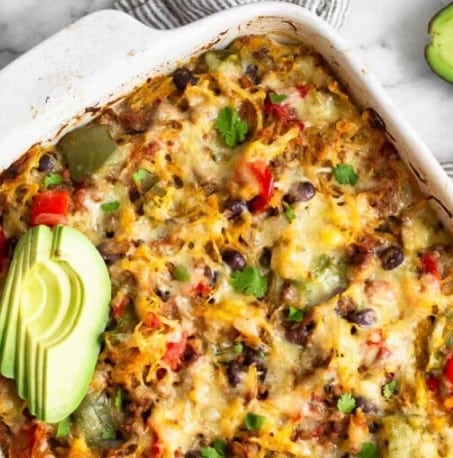 Top down view of Chili Spaghetti Squash Casserole with slices of avocado.