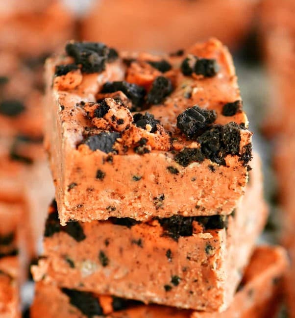 Pieces of Halloween Fudge stacked on top of one another.