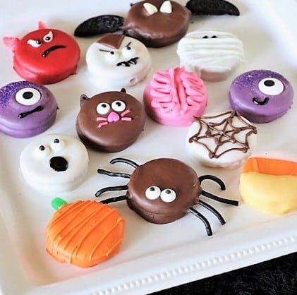 Halloween Peanut Butter Ritz Cookies decorated like spiders, pumpkins, bats, and more.