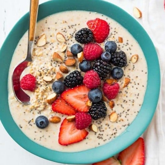 Top down view of overnight stell cut oats in a bowl with berries.