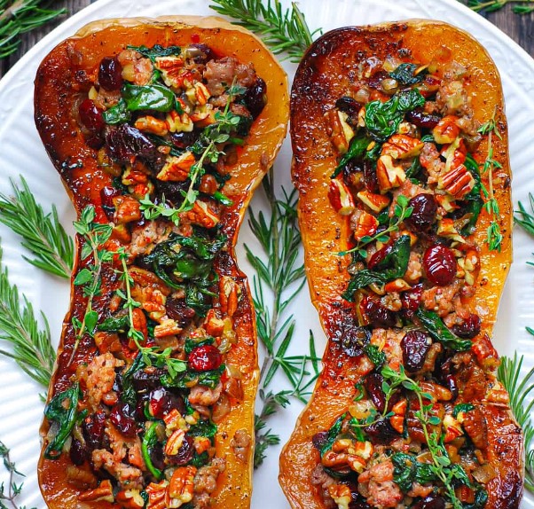 Sausage Stuffed Butternut Squash with Spinach, Pecans, and Cranberries.