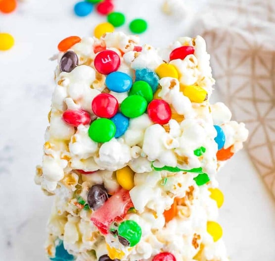 Popcorn Bars with candies stacked on top of one another.