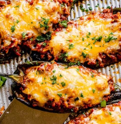 Stuffed Poblano Peppers on a baking tray.