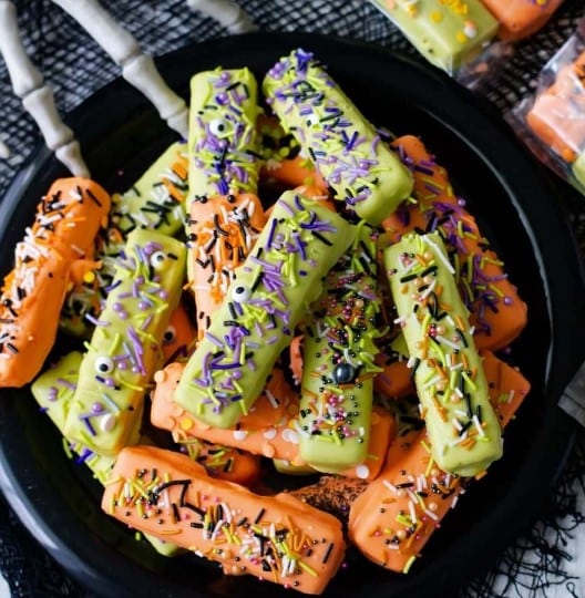 Chocolate dipped wafer cookies decorated for Halloween.