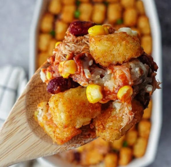 Close up of Pulled Pork Casserole on a serving spoon.