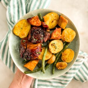 Bowl of Sheet Pan Pork Tenderloin for green beans, potatoes, and sweet potatoes.