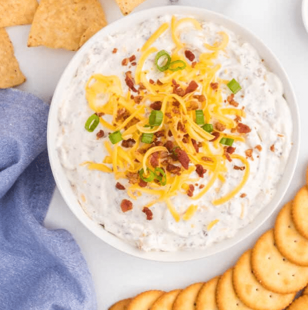 Top down view of crack dip with cheese and bacon.