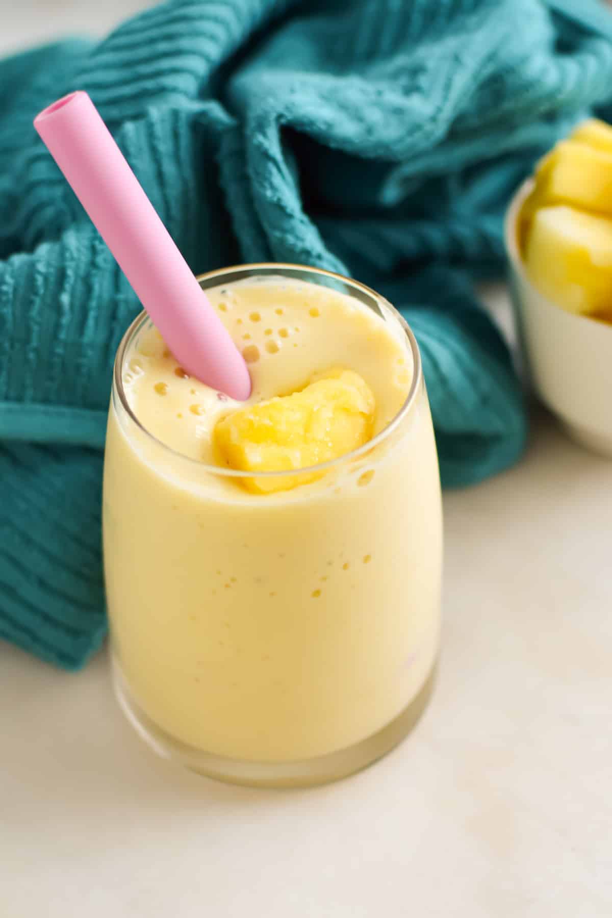 Creamy Pineapple mango smoothie in a glass.