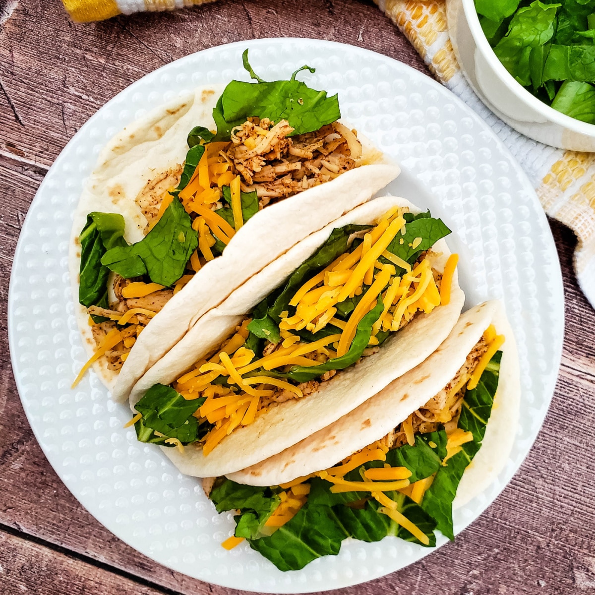 Top down view of Slow Cooker Ranch Chicken Tacos on a plate.