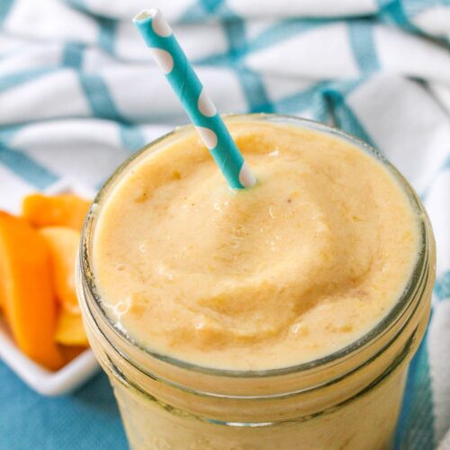 Close up of Peaches and Cream Smoothie with a straw.
