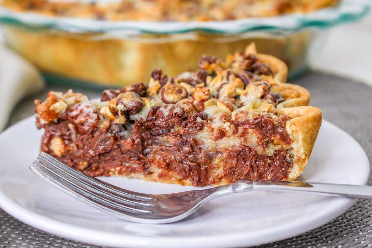 Close up of chocolate Texas Trash Pie with a fork on a plate.
