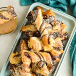 Close up of Nuetlla Puff Pastry Twists dusted with powdered sugar on a serving tray.