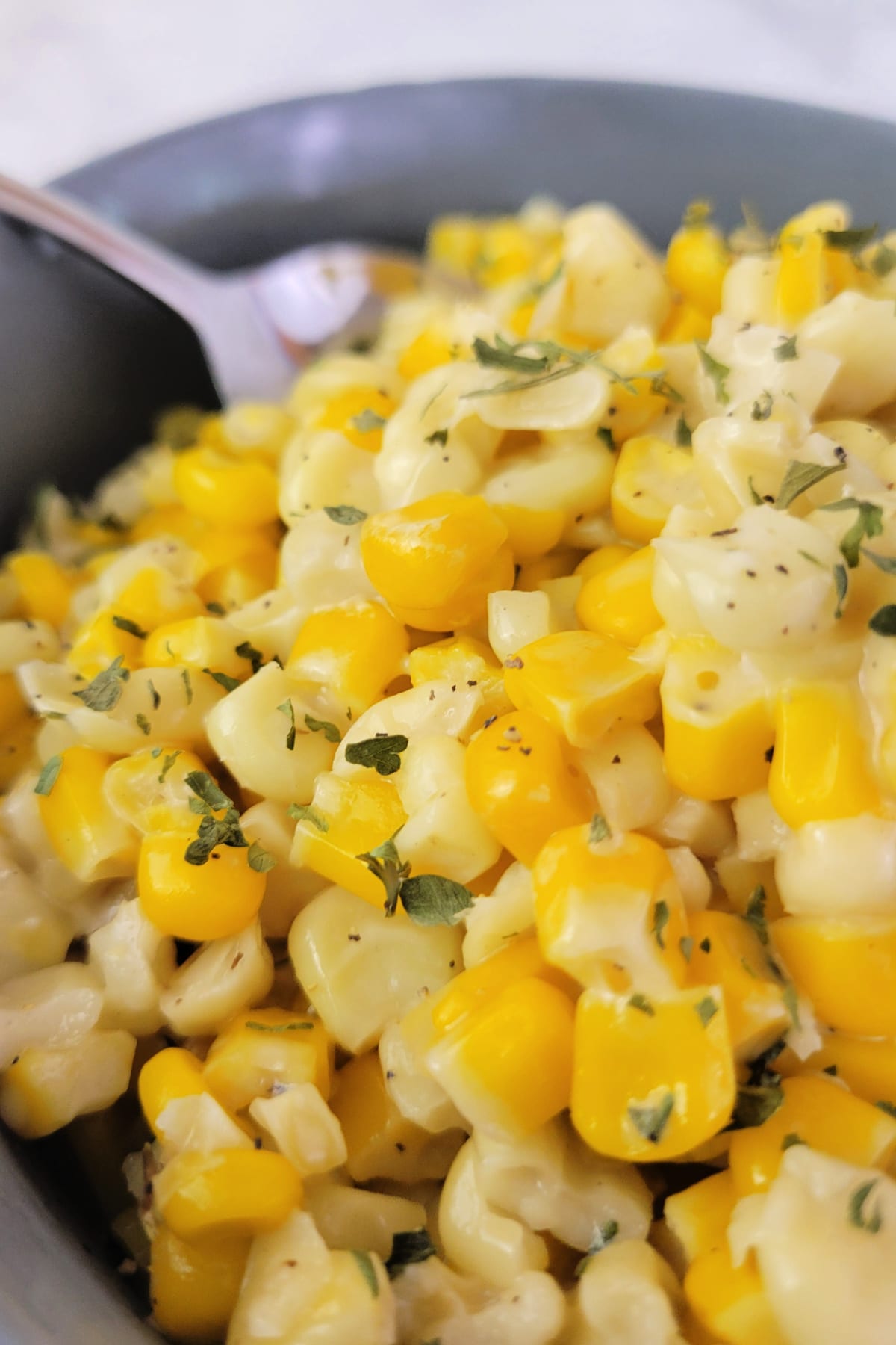 Close up of honey butter corn in a bowl.