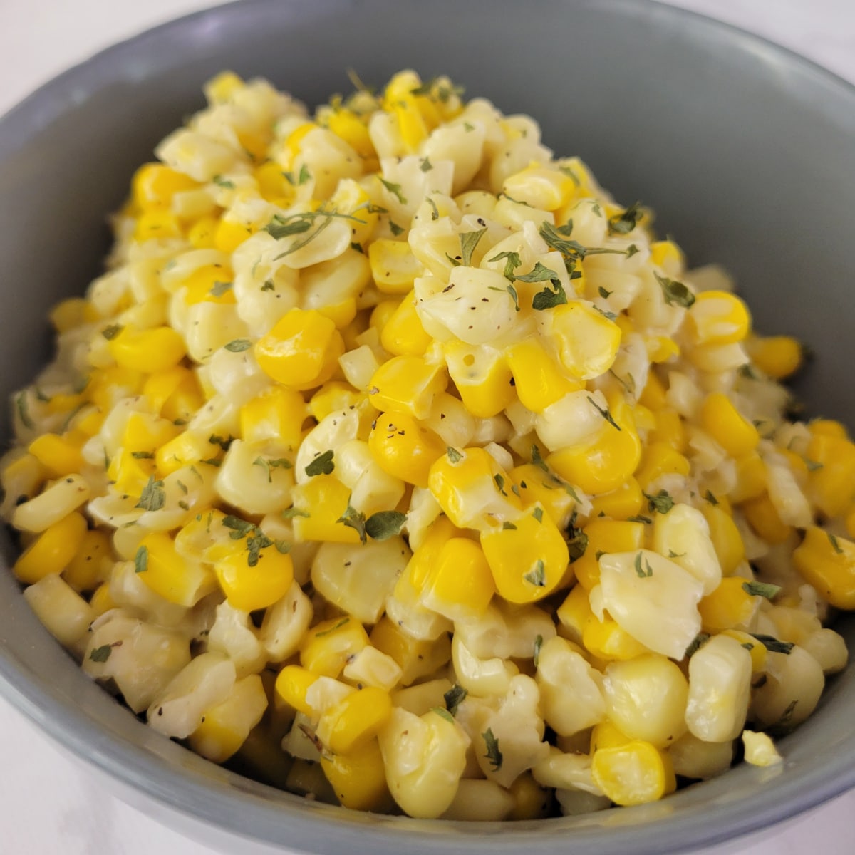 Close up of honey butter skillet corn in a bowl.