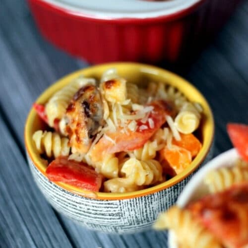 Small bowl of sausage mac and cheese with peppers.