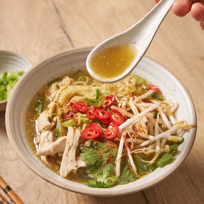 Bowl of Thai chicken noodle soup.