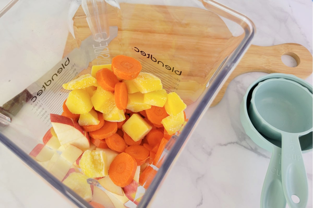 Close up of Carrot Smoothie ingredients in a blender.