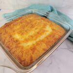 Cheddar Cornbread in a square baking dish.