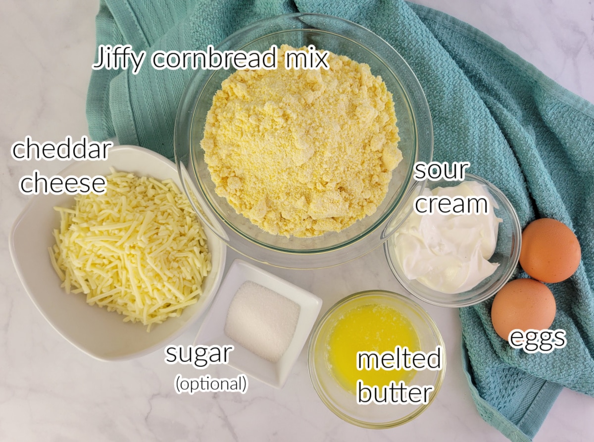 Flatlay of Cheddar Cornbread ingredients with text overlay.