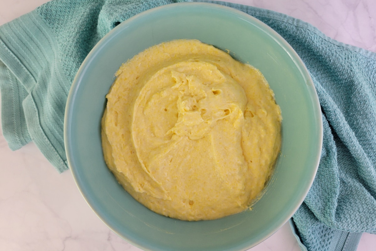 Top down view of Cheddar Cornbread batter in a bowl.