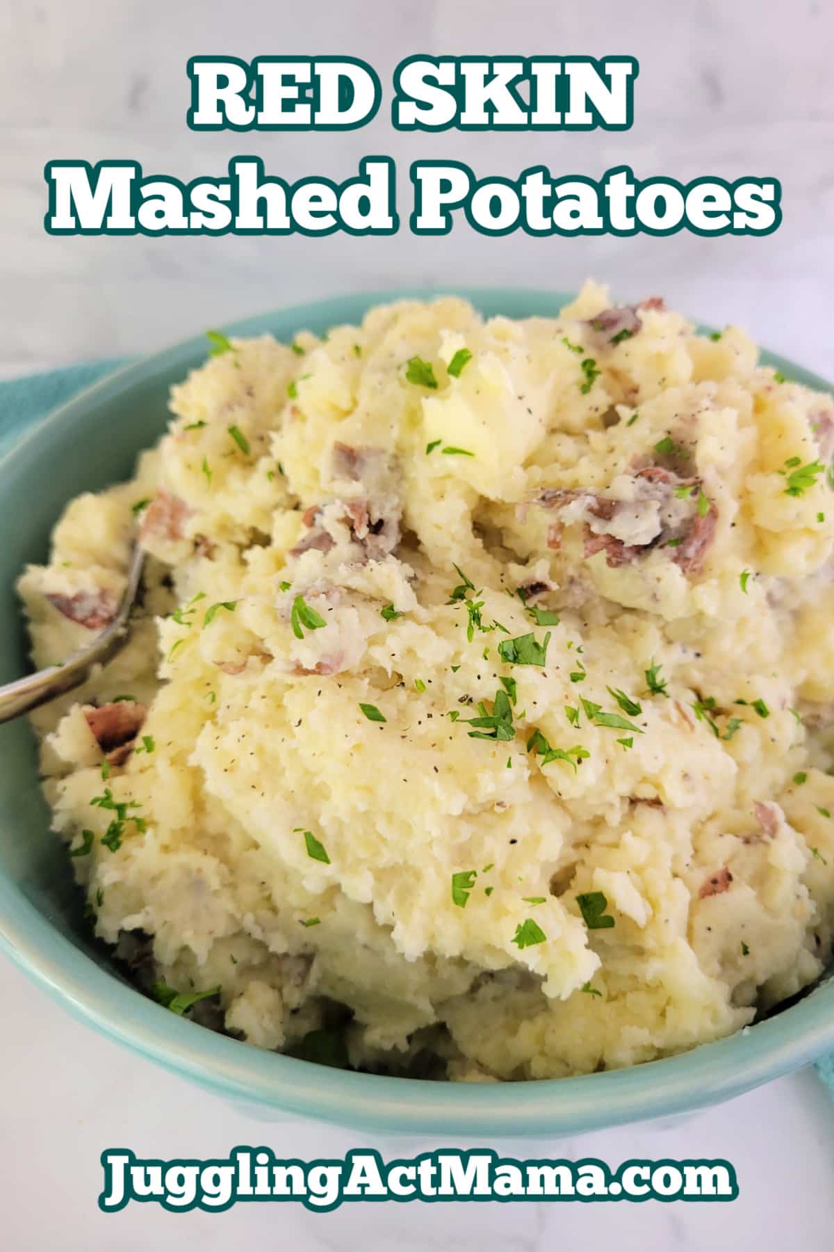 Red Skin Smashed Potatoes in a bowl with a spoon and text overlay.