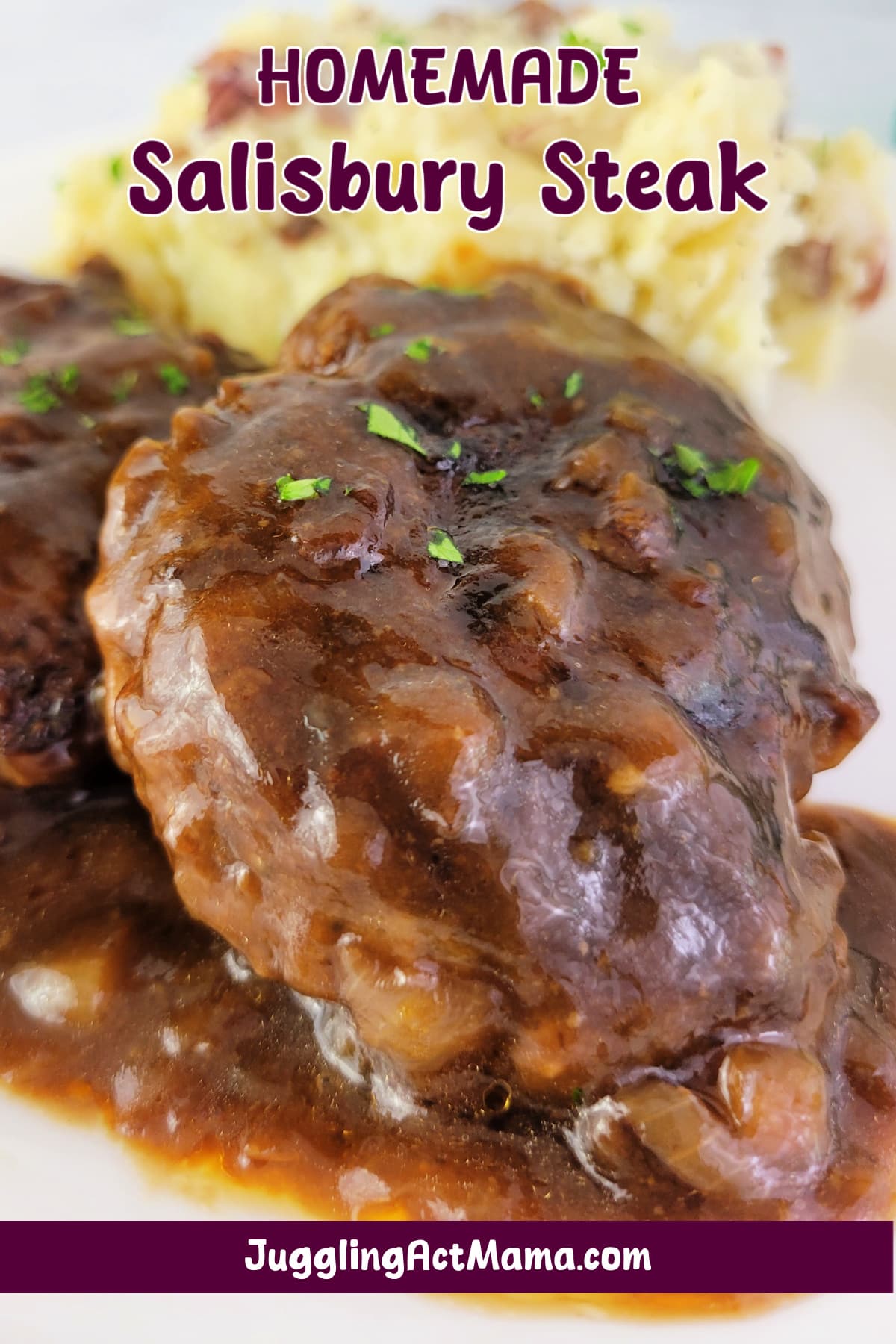 Close up of Salisbury Steak on a plate with potatoes and text overlay.