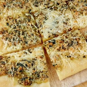 Close up of sliced Tarragon and Walnut Pesto Flatbread.