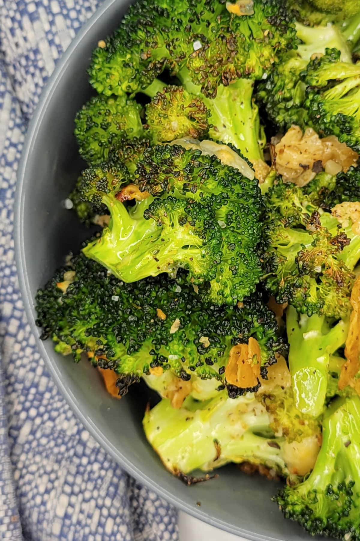 Top down view of Roasted Garlic Parmesan Broccoli in a bowl.