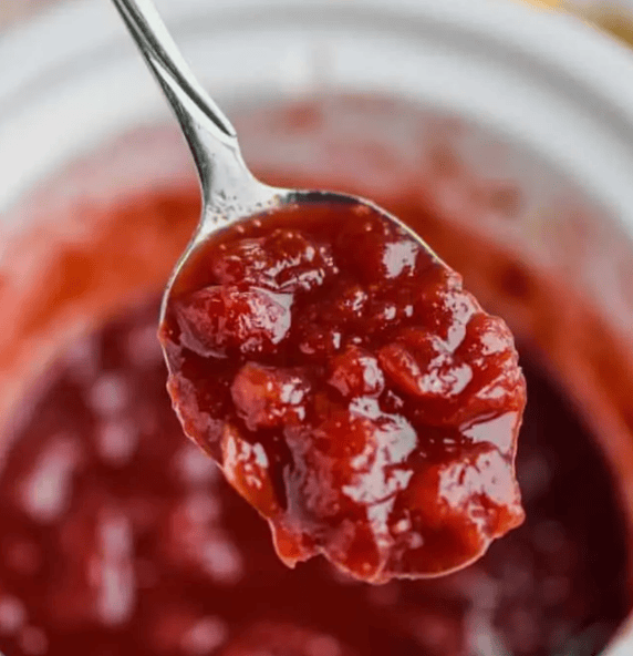 Spoonful of crockpot cranberry sauce.