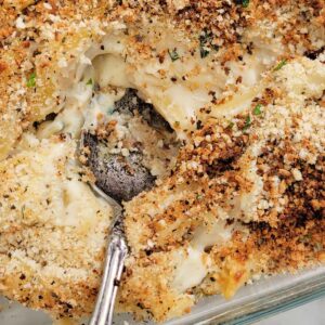 Close up of baked mac and cheese with seasoned breadcrumb topping.