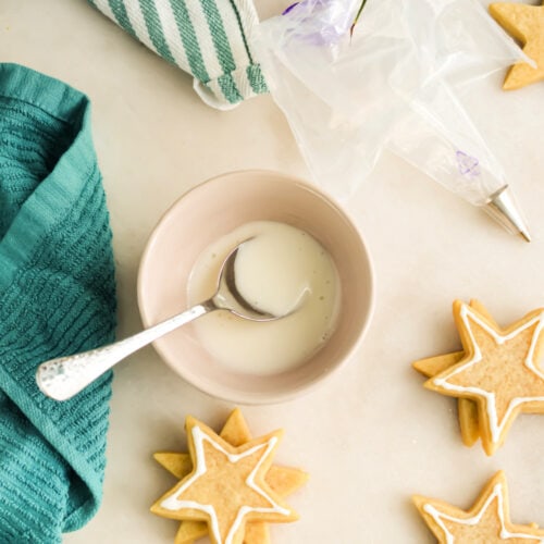 Vegan Royal Icing in a bowl with a spoon.