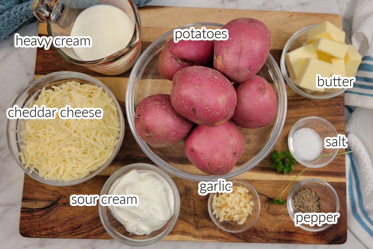 White Cheddar Mashed Potatoes ingredients in bowls with text overlay.