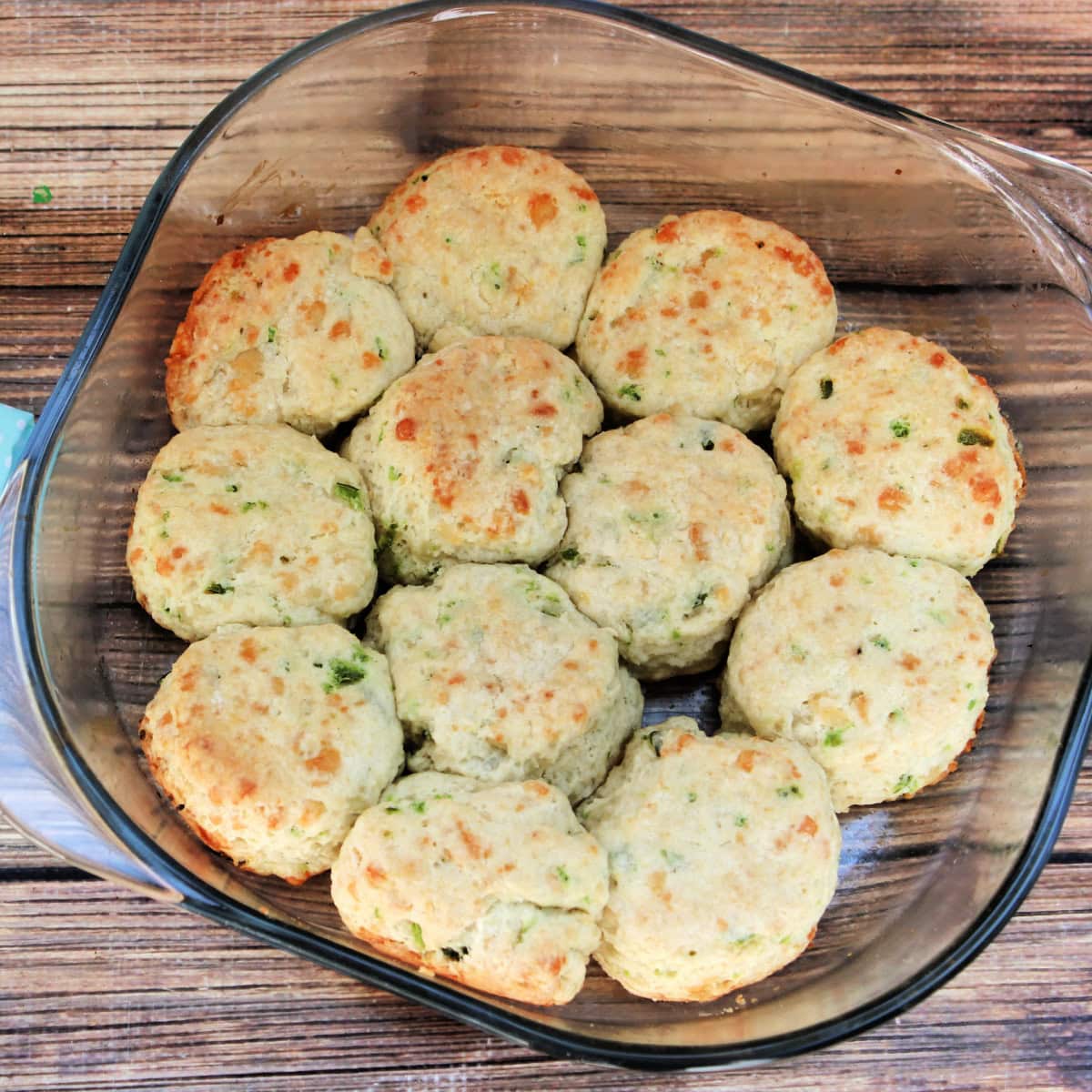 Top down view of homemade jalapeno biscuits in a baking dish.