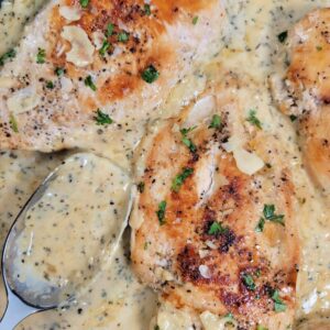 Creamy Garlic Parmesan Chicken with a spoon.