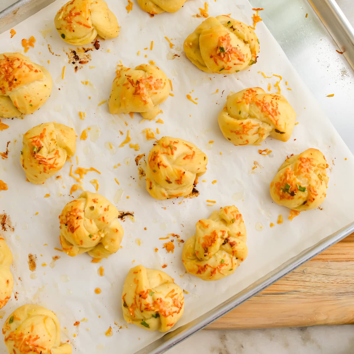 Baking sheet full of Cowboy Butter Garlic Knots.