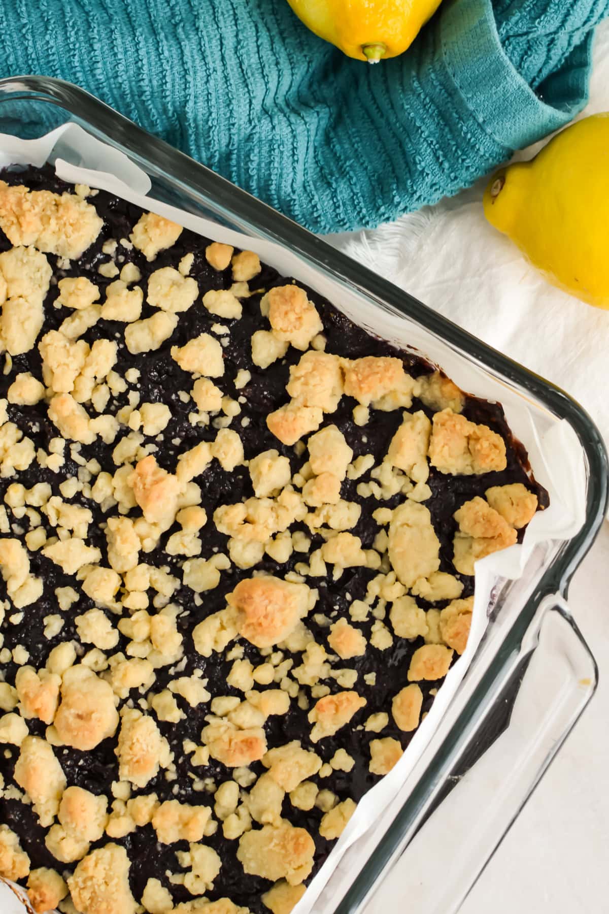 Easy Blueberry Lemon Bars with blueberry pie filling in a baking dish.