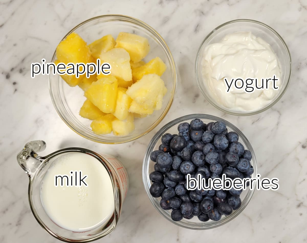 Blueberry pineapple smoothie ingredients with text overlay.